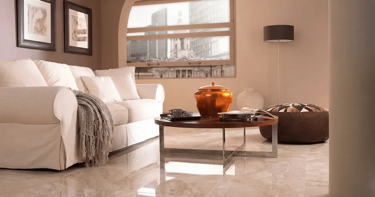 Modern living room with professionally installed marble flooring, a beige sofa, coffee table in Philadelphia, PA